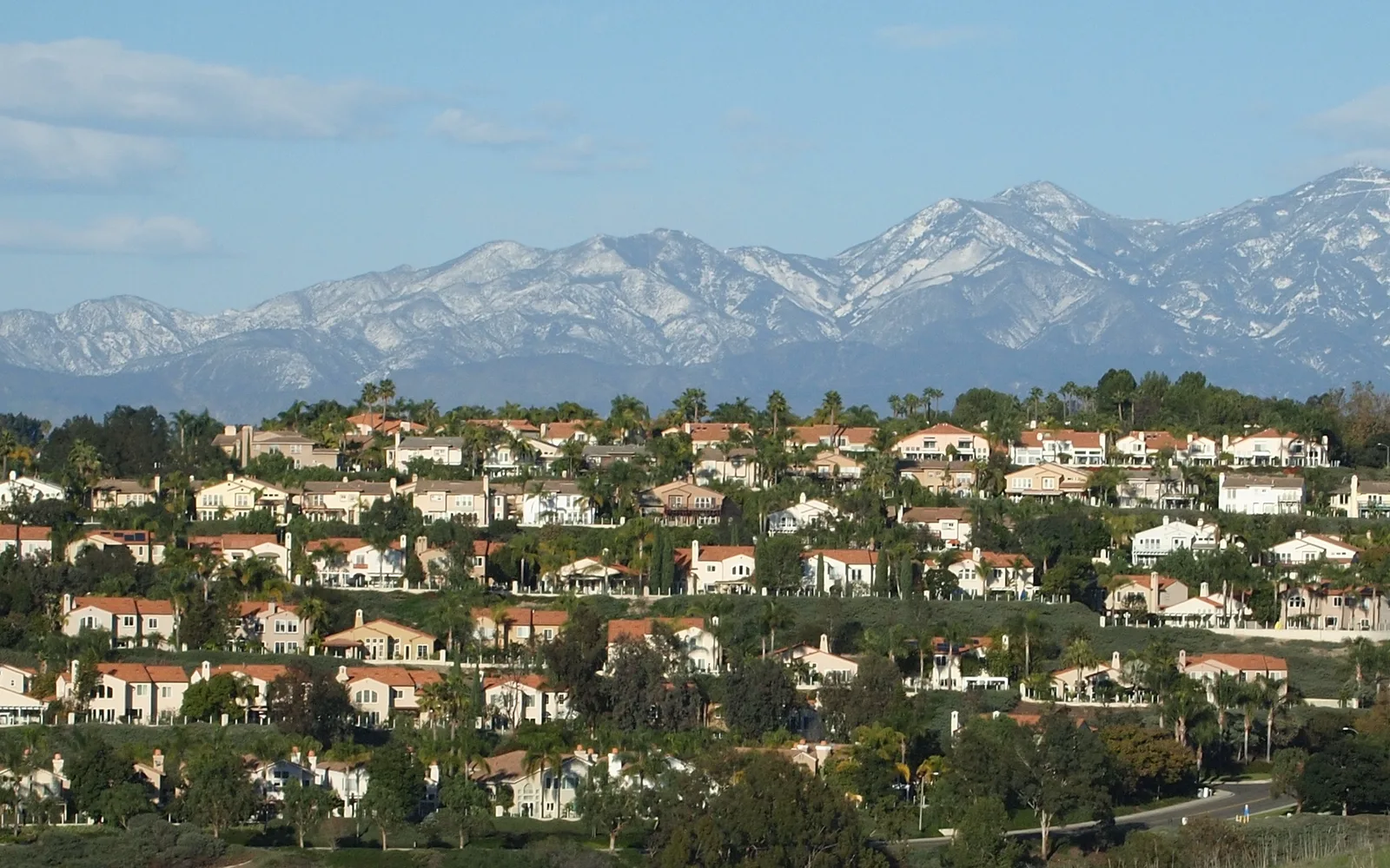 Rows of suburban tract homes with Santa Ana mountains visible in Laguna Niguel, California